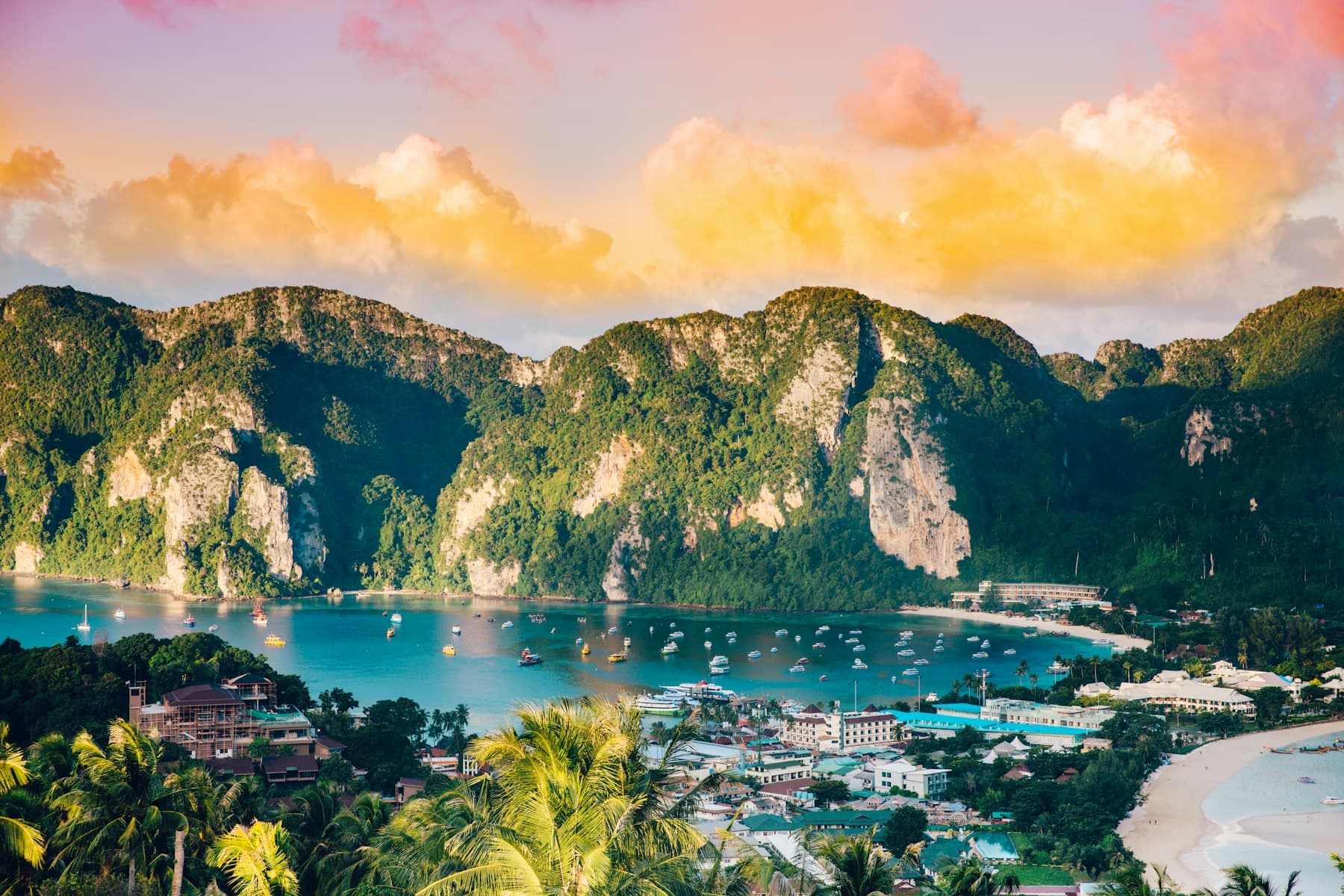Limestone karsts and a turquoise bay seen from a viewpoint in Thailand